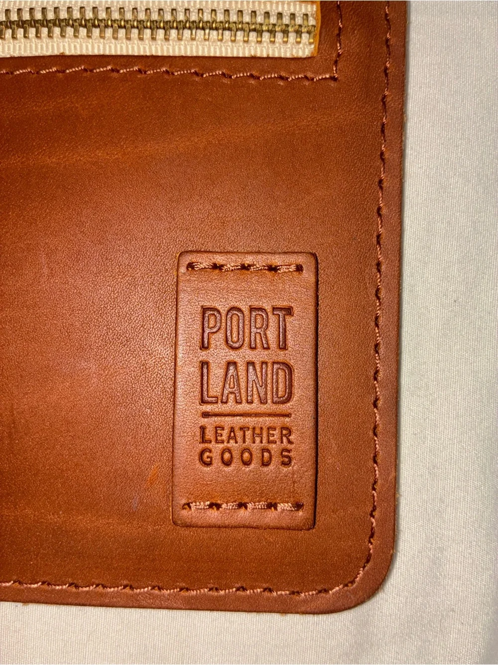 Portland Leather Goods brown leather wristlet zipper pouch with removable strap